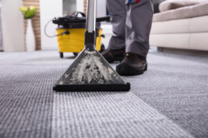 a carpet being cleaned in an apartment